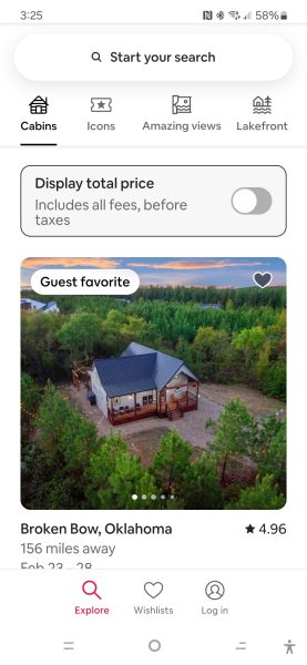 A vacation rental app interface highlights a "Guest favorite" cabin in Broken Bow, Oklahoma. Emphasizing a mobile-first world, the design adapts seamlessly with options like "Cabins," "Icons," and "Lakefront" at the top, showcasing an image of a tree-encircled cabin.